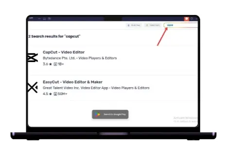 Laptop displaying playstore page on bluestack emulator